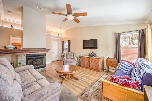 living room featuring crown molding, vaulted ceiling, light hardwood / wood-style floors, and ceiling fan