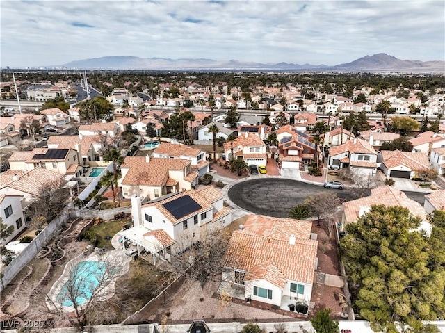 birds eye view of property featuring a mountain view