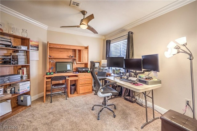 carpeted office space with crown molding and ceiling fan