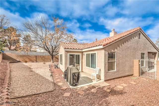 back of property featuring a patio