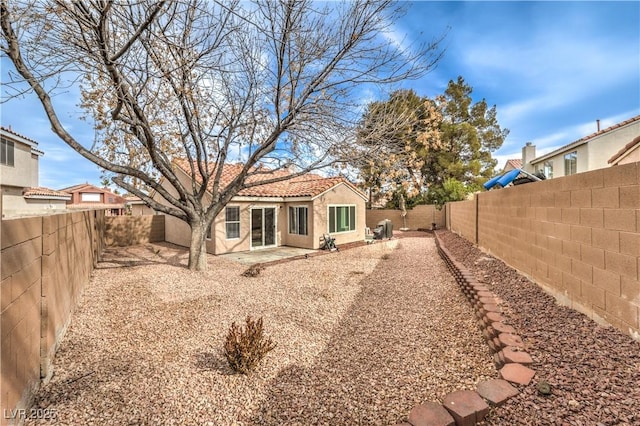 rear view of property featuring a patio area