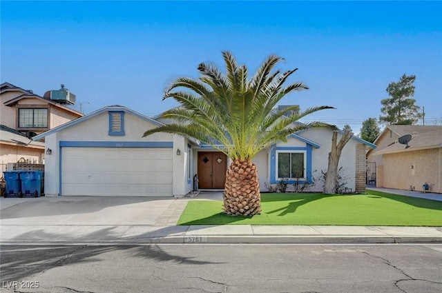 view of front of house featuring a garage, cooling unit, and a front lawn