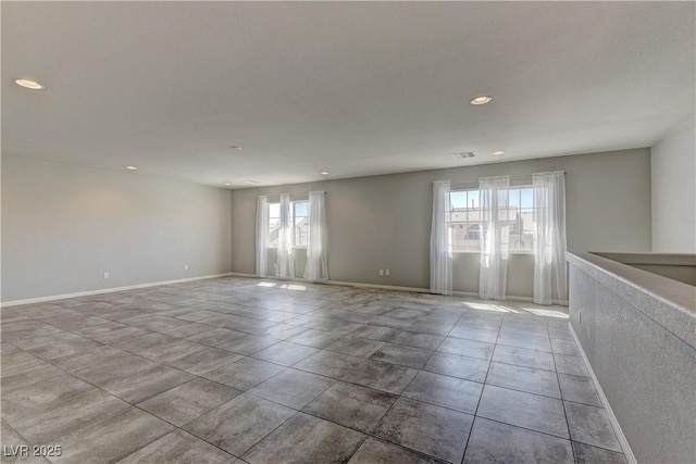 spare room featuring light tile patterned floors