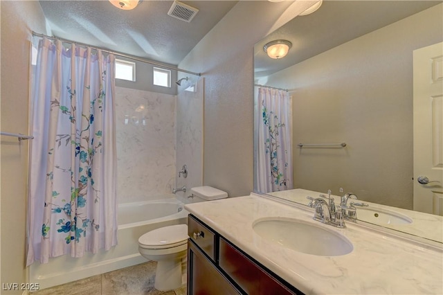 full bathroom with tile patterned flooring, vanity, shower / bath combination with curtain, a textured ceiling, and toilet