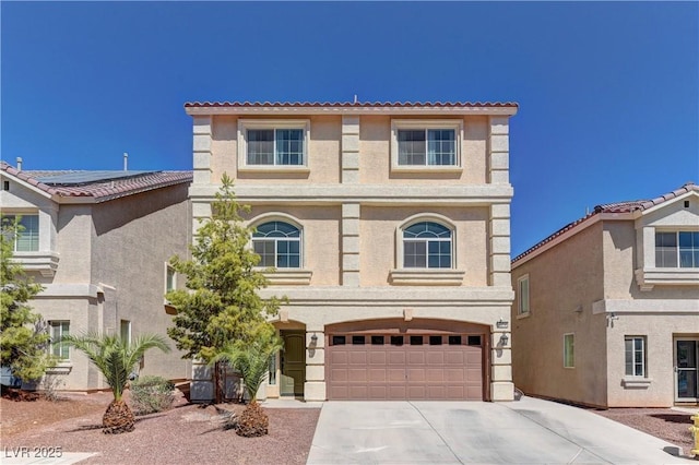 mediterranean / spanish-style home featuring a garage