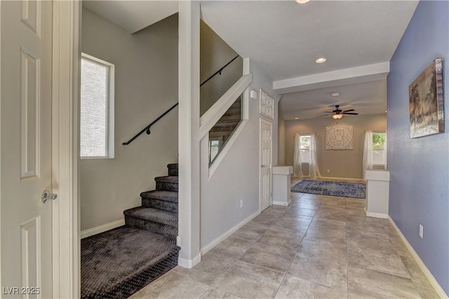 entrance foyer with ceiling fan