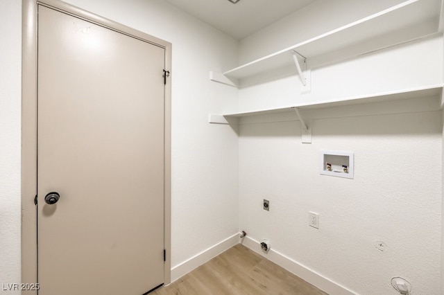 washroom with light wood-style flooring, laundry area, washer hookup, baseboards, and electric dryer hookup