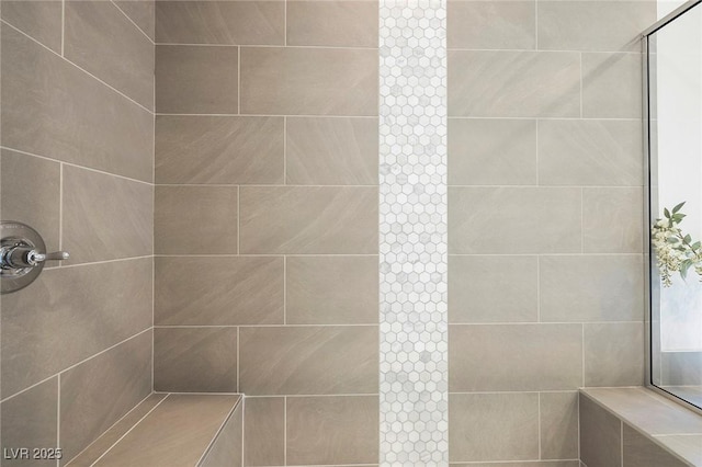 bathroom with tiled shower