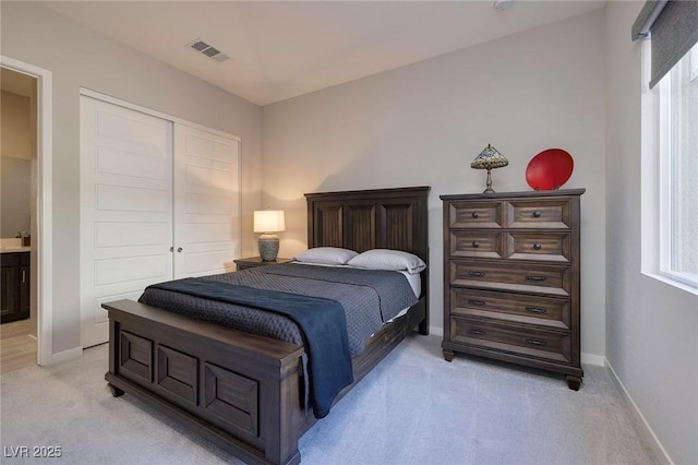 carpeted bedroom featuring a closet