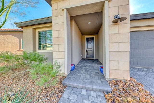 property entrance with a garage