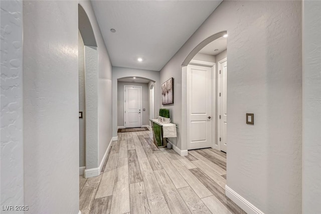 corridor featuring light hardwood / wood-style flooring