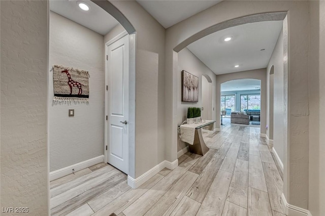 hall with light hardwood / wood-style floors