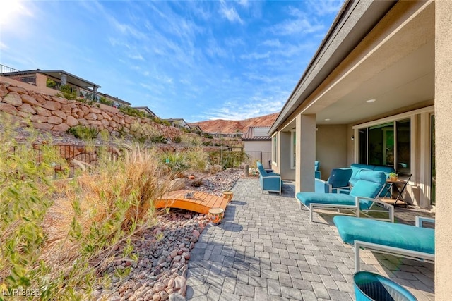 view of patio / terrace featuring a mountain view and an outdoor hangout area