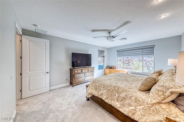 bedroom featuring light carpet and ceiling fan