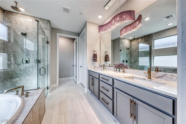 bathroom featuring vanity and plus walk in shower