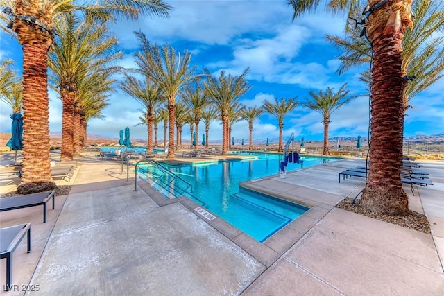 view of pool featuring a patio area