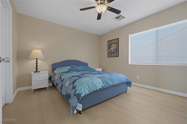 bedroom featuring hardwood / wood-style floors and ceiling fan