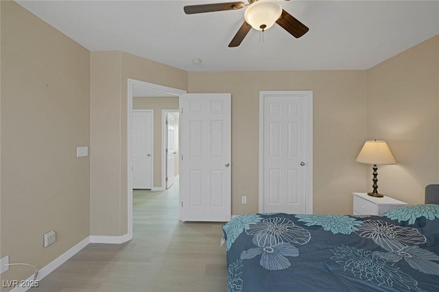 bedroom with ceiling fan and light hardwood / wood-style flooring