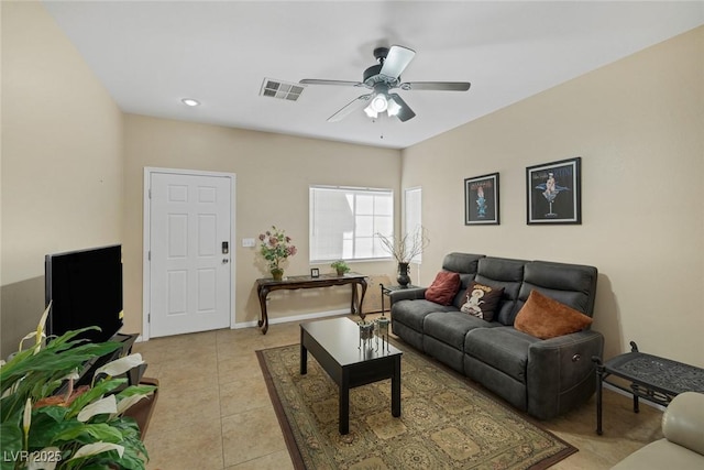 living room featuring ceiling fan and light tile patterned flooring