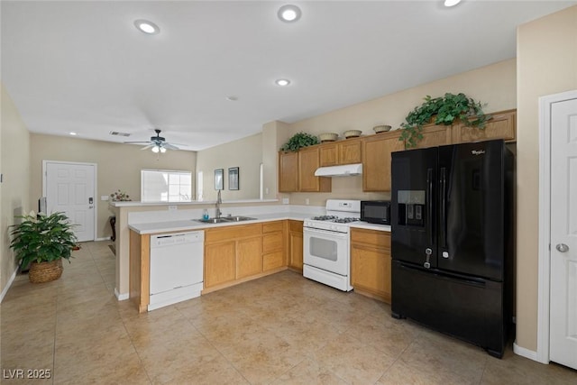 kitchen with sink, light tile patterned floors, kitchen peninsula, ceiling fan, and black appliances