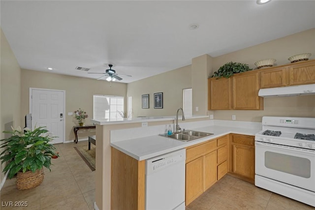 kitchen with sink, white appliances, kitchen peninsula, and light tile patterned flooring