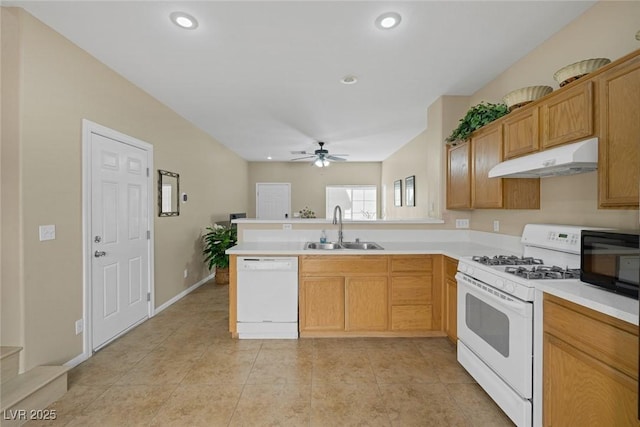 kitchen with sink, light tile patterned floors, ceiling fan, kitchen peninsula, and white appliances