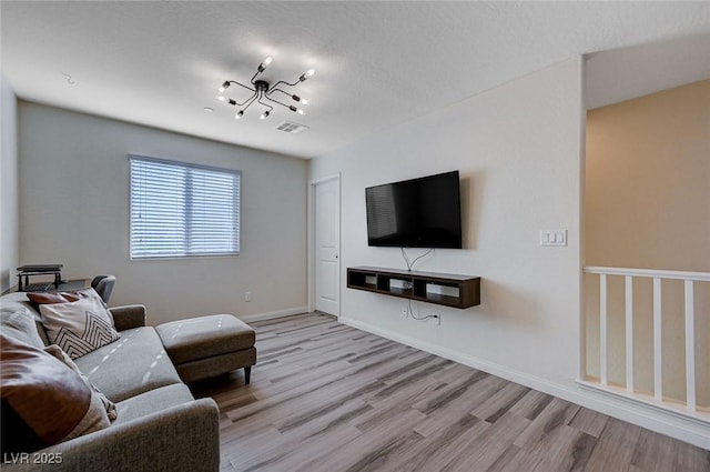 living room with light hardwood / wood-style flooring