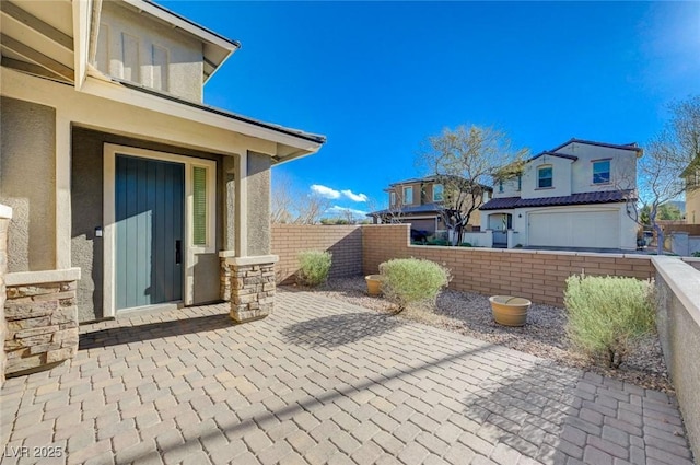 view of patio with a garage