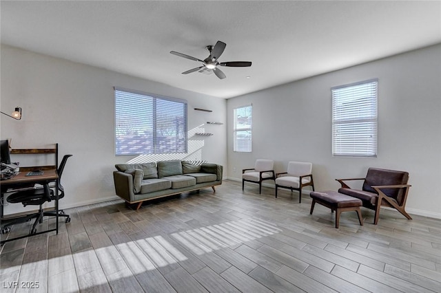 interior space with ceiling fan