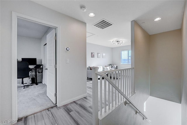 corridor featuring light hardwood / wood-style floors