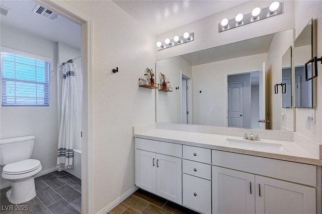 full bathroom with vanity, shower / bath combination with curtain, and toilet