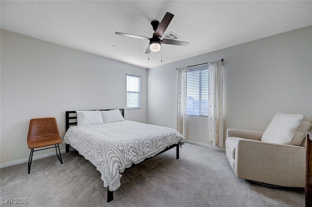 bedroom featuring ceiling fan and carpet