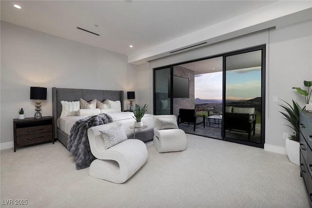 bedroom featuring light colored carpet and access to exterior