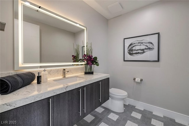 bathroom with vanity and toilet