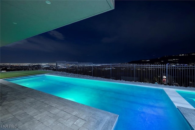 view of pool at night