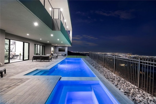 view of pool with an outdoor living space, an in ground hot tub, and a patio