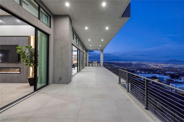 view of balcony at dusk