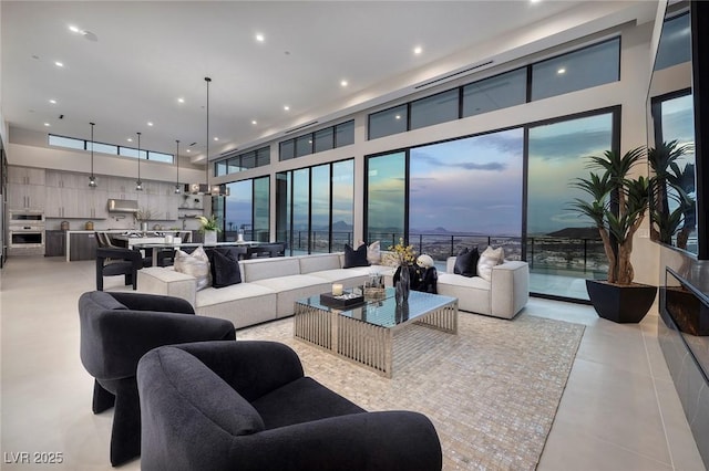 living room featuring a high ceiling