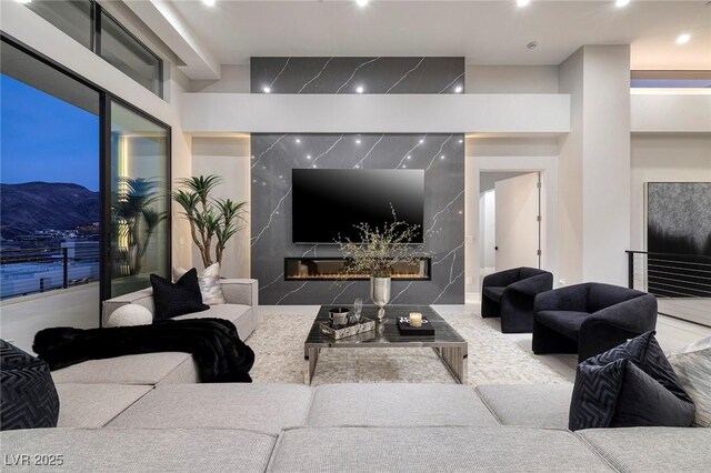 living room featuring a premium fireplace