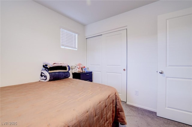 carpeted bedroom featuring a closet