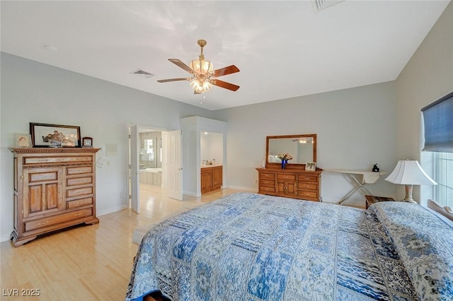 bedroom with ceiling fan, ensuite bathroom, and light hardwood / wood-style flooring