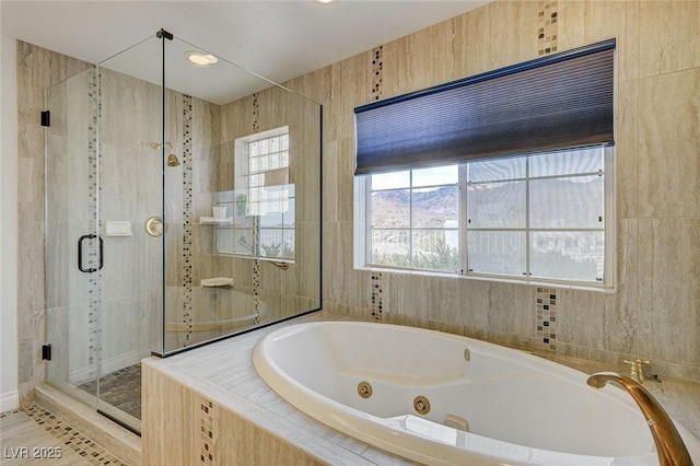 bathroom featuring tile patterned flooring and shower with separate bathtub