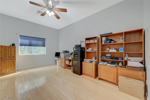 home office with ceiling fan and light hardwood / wood-style floors