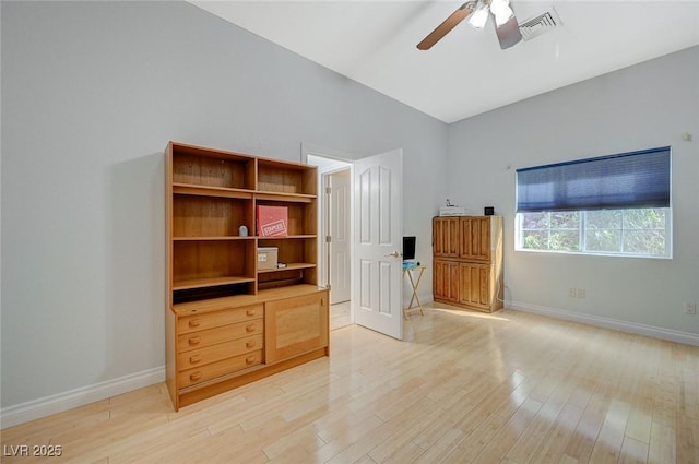 unfurnished bedroom with ceiling fan and light hardwood / wood-style flooring