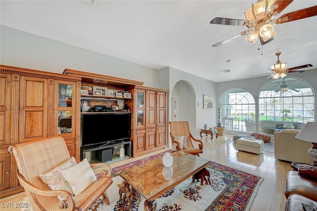 living room featuring ceiling fan and light wood-type flooring