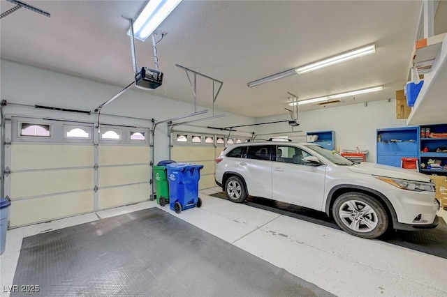 garage featuring a garage door opener