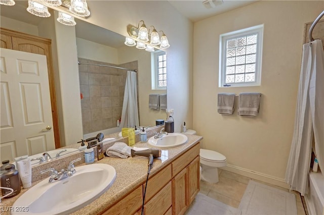 full bathroom featuring vanity, shower / bath combo, tile patterned floors, and toilet