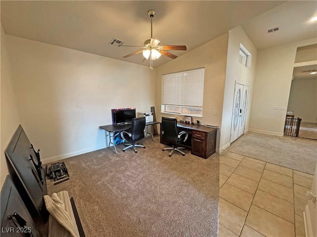 carpeted office featuring ceiling fan and vaulted ceiling