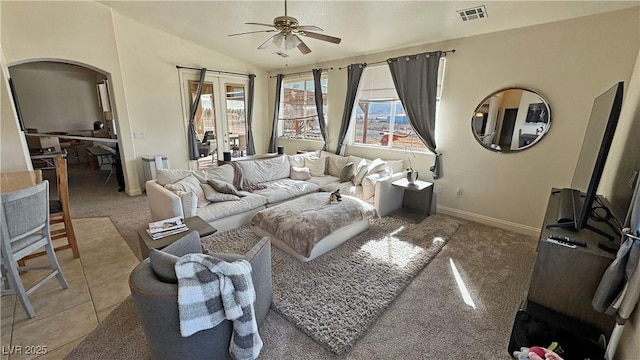 carpeted living room featuring vaulted ceiling and ceiling fan