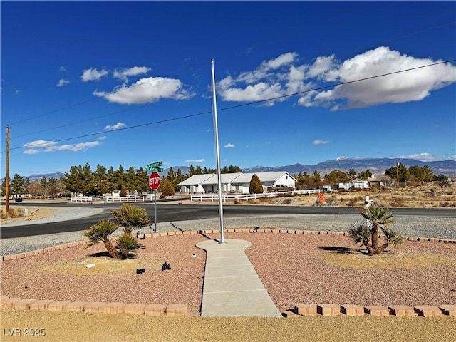 surrounding community with a mountain view